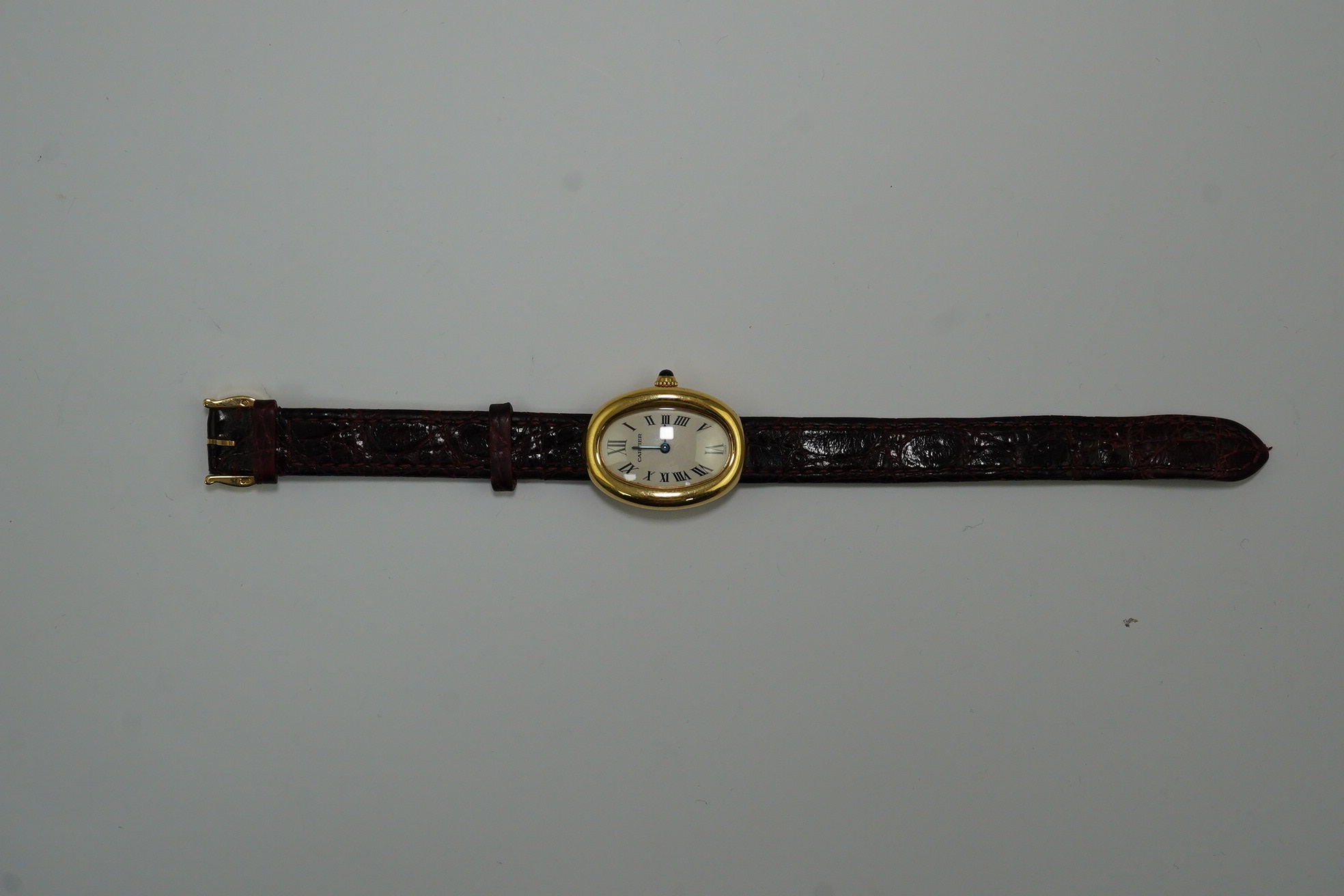 A lady's 2000 18ct gold Cartier Baignoire quartz wrist watch, on a Cartier leather strap